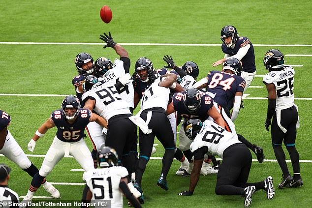 Seconds later, Kmet (left) was in his supporting role as the team's long snapper for the PAT.