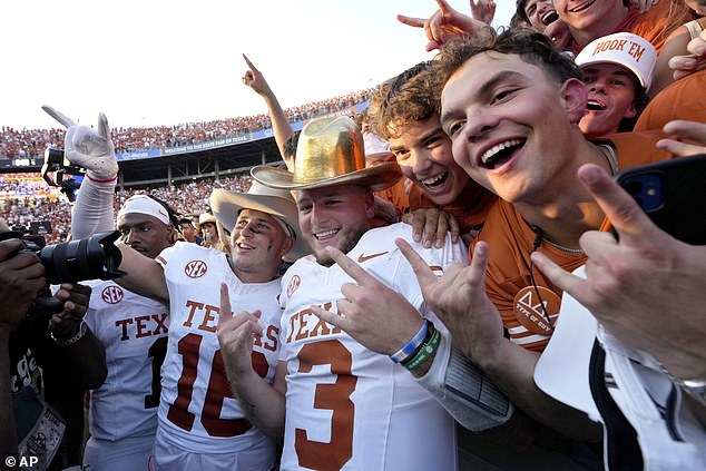 Texas quarterback Quinn Ewers celebrates with his teammates and fans after the latest victory.