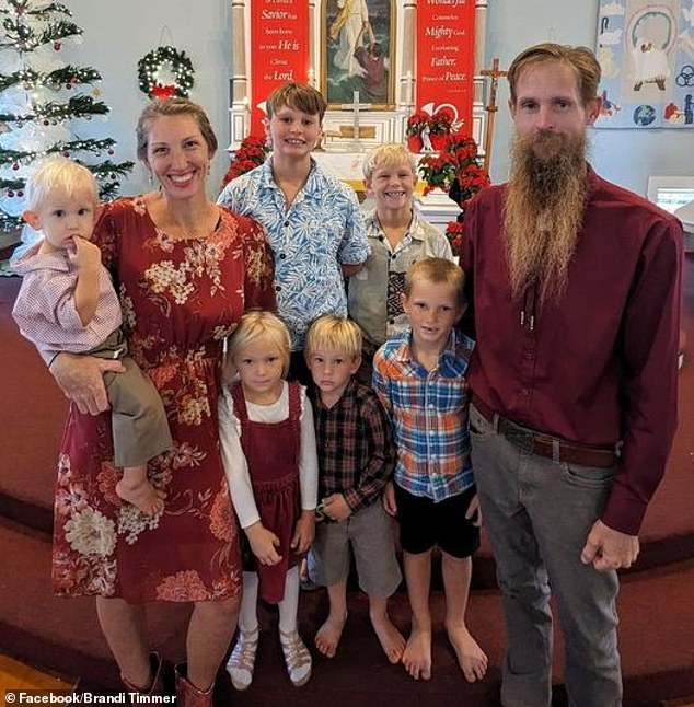 Andrew (pictured in the bottom row, center, surrounded by his family) was medically evacuated to Kapiolani on Oahu Saturday morning and still has a heartbeat, according to Bethany.