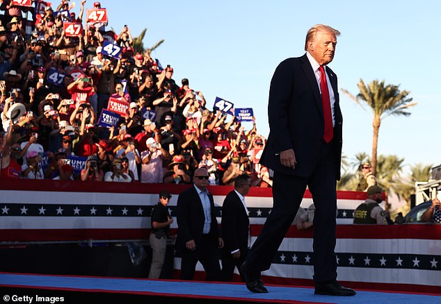 Republican presidential candidate former US President Donald Trump takes the stage for a campaign rally on October 12, 2024 in Coachella, California.