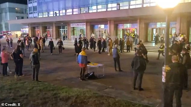 People gathered in front of the Sports Palace where the Ukrainian rock band Okean Elzy played.