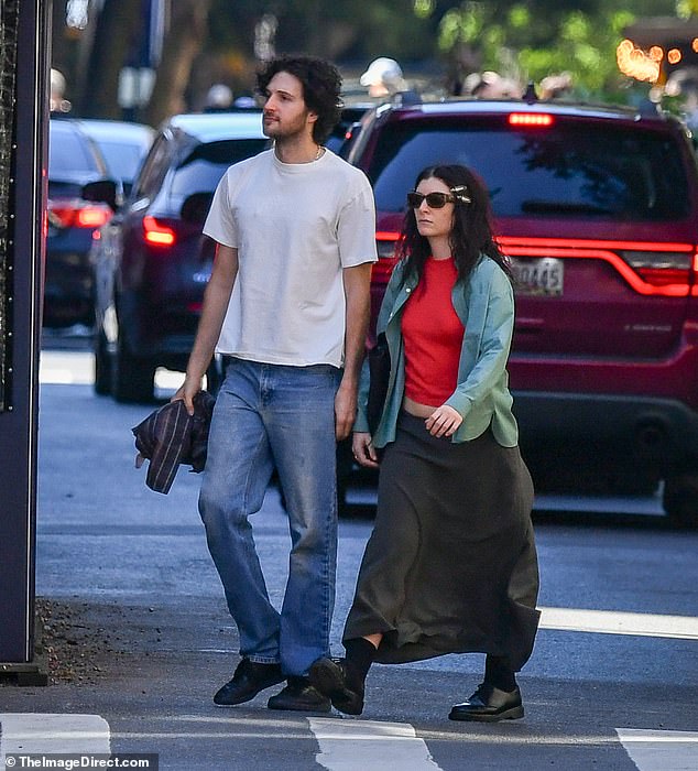 The New Zealand singer appeared close to the producer, who is rumored to be helping her with her new album, while they were out for a walk in the city.