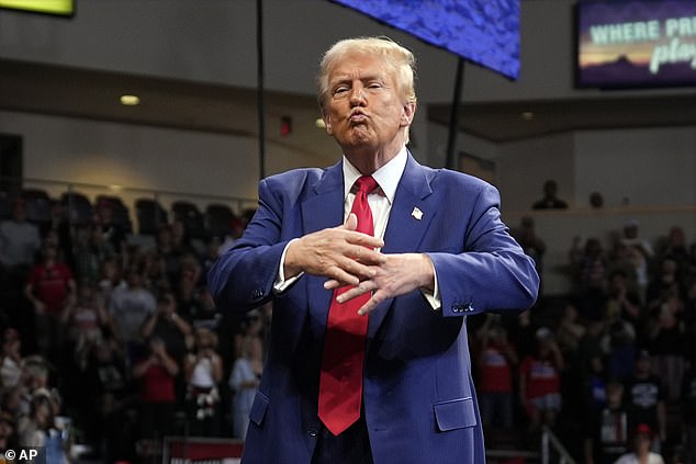 Former President Donald Trump, Republican presidential candidate, gestures at a campaign rally at the Findlay Toyota Arena on Sunday, October 13, 2024