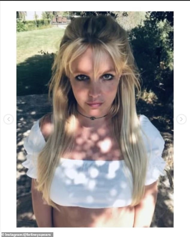 In the post, Britney shared identical selfies while posing outside under a shady tree that protected her from the bright sun.