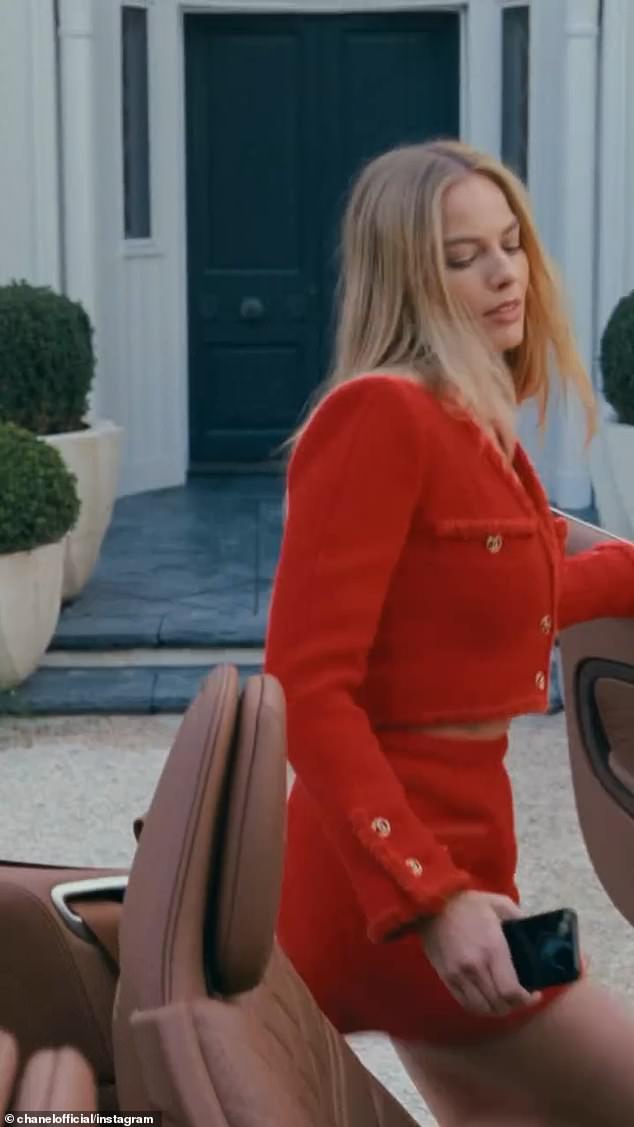 Actress Barbie then puts on an elegant red swimsuit and applies Chanel No5 for her date as she climbs into a luxurious open-top car to head towards her lover.