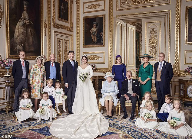 From left to right: Thomas Brooksbank; Nicola Brooksbank; George Brooksbank; Princess Beatrice; Sarah, Duchess of York; Prince Andrew, Duke of York. Middle row: Prince George; Princess Charlotte; Queen Elizabeth; Prince Philip, Duke of Edinburgh; Maud Windsor; Louis de Givenchy; Front row: Theodora Williams; Mia Tindall; Phillips Island; Savannah Phillips