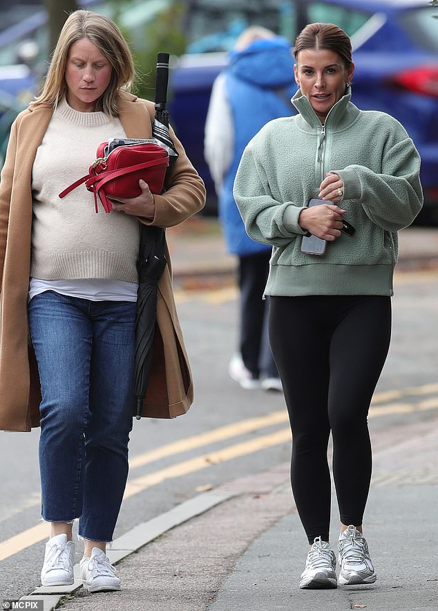 The mother of four flashed her smile as she chatted with a friend as she arrived at the restaurant.