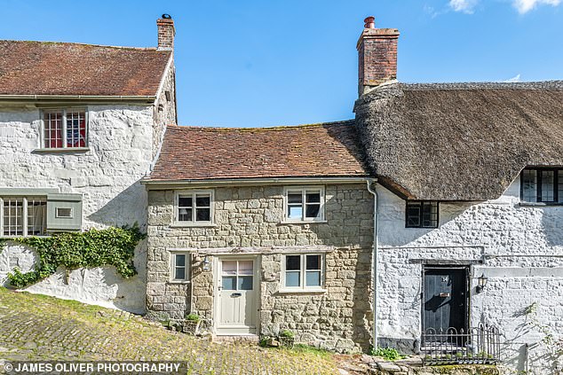 Hovis Hill is actually called Gold Hill and runs through Shaftesbury, Dorset. Button Cottage is the property in the middle in the image above.