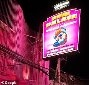 The neon sign of the place, with the words 