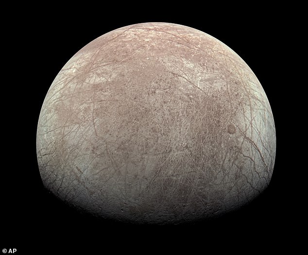 Europa, one of Jupiter's 95 known moons, is encased in a shell of ice estimated to be 10 to 15 miles thick or more.