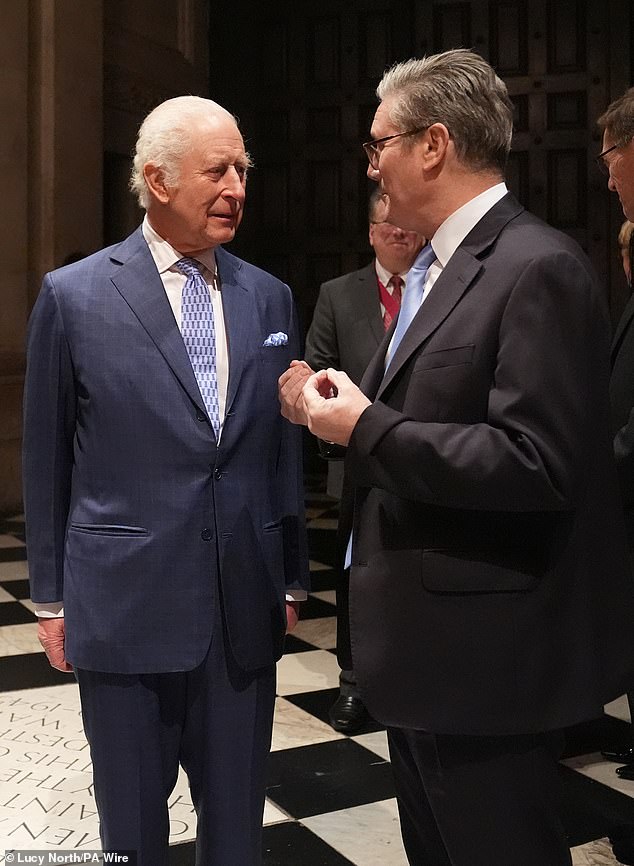 The King was pictured addressing Prime Minister Sir Keir Starmer during tonight's glittering reception.