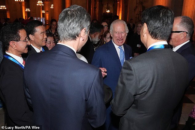 The royal appeared to be in good spirits as he exchanged conversations with other attendees at the event.