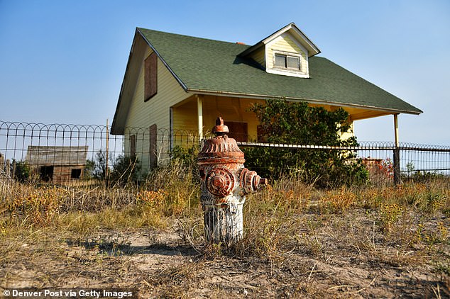 Pictured: A home in Keota that's in incredibly good condition, complete with a relic of a fire hydrant.