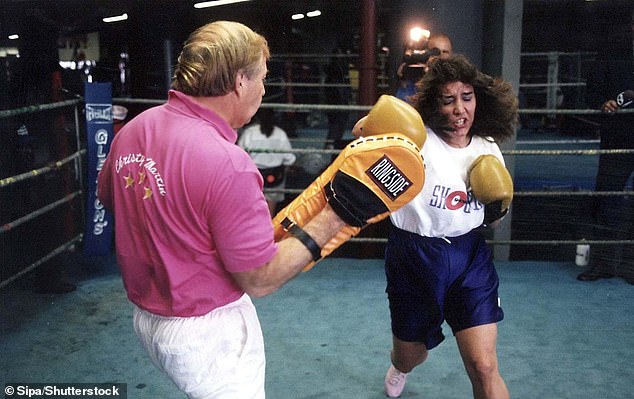 Christy, 56, originally from West Virginia, is credited with putting women's boxing on the map after facing Deirdre Gogarty in front of a sold-out crowd at the MGM Grand in Las Vegas in 1996 (pictured with Jim in 1996).