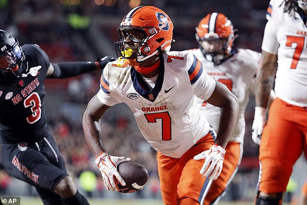 Syracuse's Jackson Meeks (7) celebrates his touchdown against North Carolina State