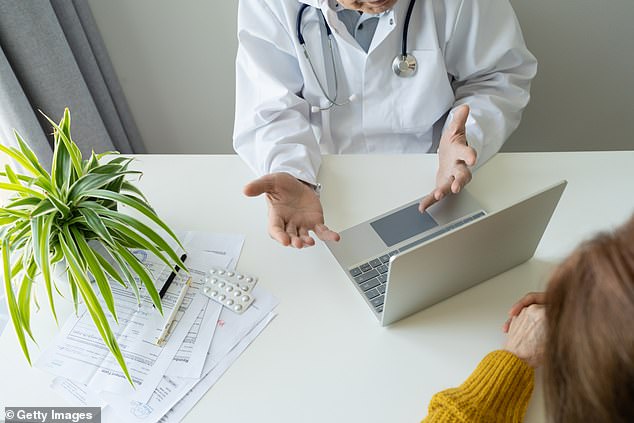 A doctor talks to a patient in front of a laptop in a clinic. The survey of 2,000 British women revealed interesting information