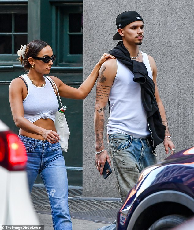 Meanwhile, Gray, who lives in the Big Apple, showed off his impressive abs in a matching white vest.