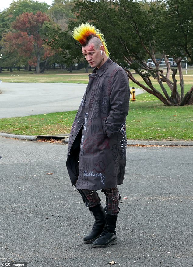 However, Smith sported a very different look, highlighted by the colorful yellow and maroon mohawk on his head.