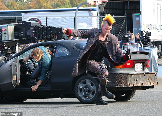 One of the shots they were filming involved Butler and Smith running away from their gray car for some reason.