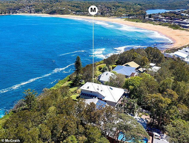 The house sits right at the top of the cliff on a 790 square meter lot and is just a walk from the beach.