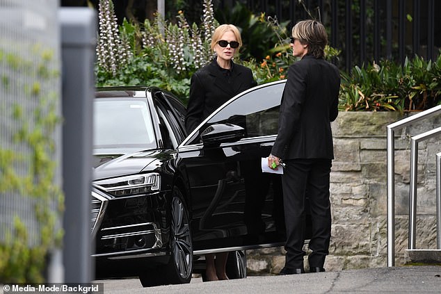 Keith held the car door for her as she arrived to join her family and say goodbye to her beloved matriarch Janelle.