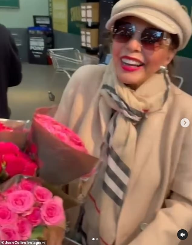 Joan also wore a pair of oversized brown sunglasses while inside the store and sported vibrant red lipstick while picking up chicken, salad and a bouquet of roses.