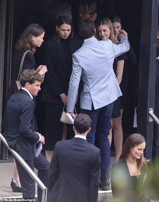 Rarely seen all together, the cousins ​​exemplified their very close bond as they all shared close hugs and comforted each other as they arrived at church (pictured: Hamish hugging on Sunday).