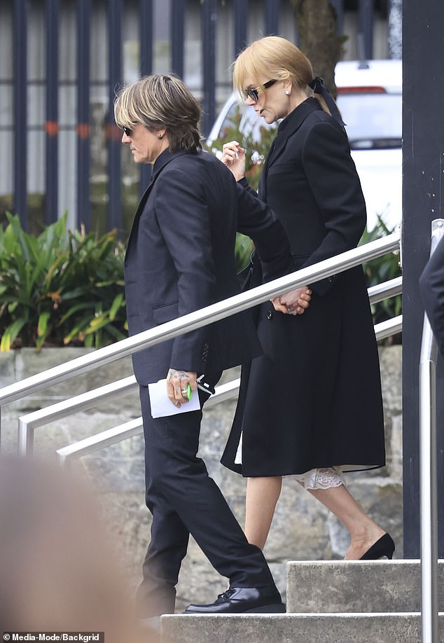 Nicole was seen arriving at the church hand in hand with her loving husband Keith, 56.