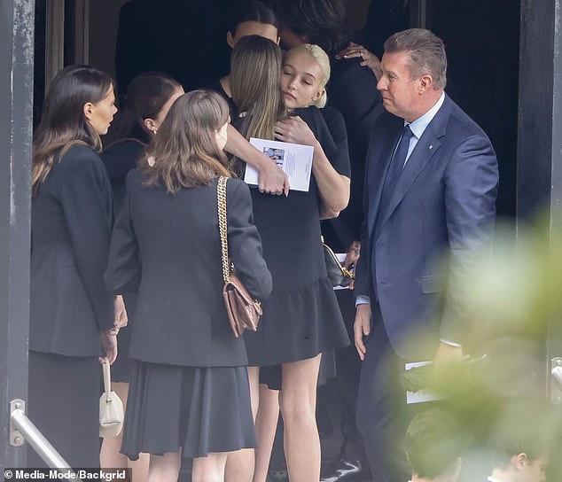 Sunday and Faith were also comforted by Jessica Rowe's model daughter Allegra Overton at her grandmother Janelle's funeral in Sydney on Tuesday (also pictured: Pete Overton).