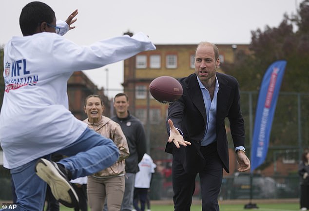 The Prince of Wales, 42, showed off his own soccer skills by throwing the ball to members of the NFL Foundation.