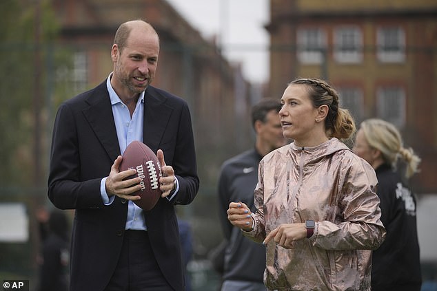 Prince William talks to Phoebe Schecter while attending an NFL Foundation NFL Flag Event