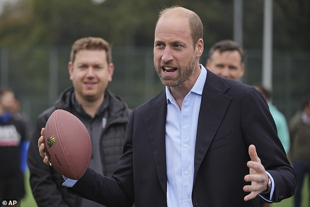 Britain's Prince William gestures as he speaks while attending an NFL Foundation NFL Flag event.