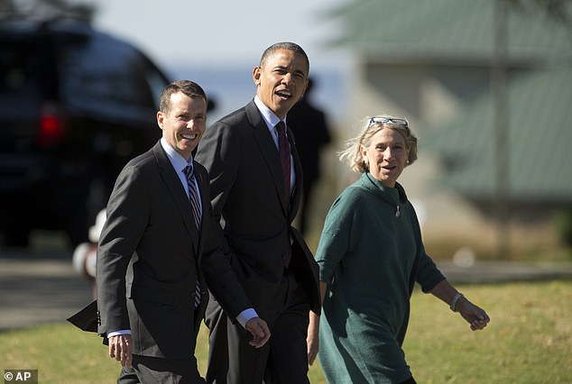 President Barack Obama, accompanied by adviser Anita Dunn (right) and White House senior adviser David Plouffe, in 2012.