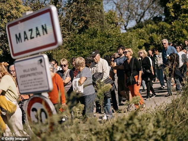 People take part in a march in support of rape victim Gisele Pelicot on October 5, 2024 in Mazan, France.