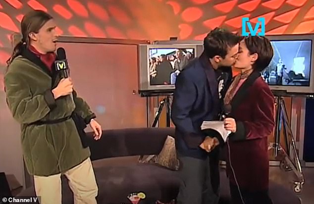 Robbie Williams leaned in and gave Yumi Stynes ​​a passionate 'kiss' live on TV