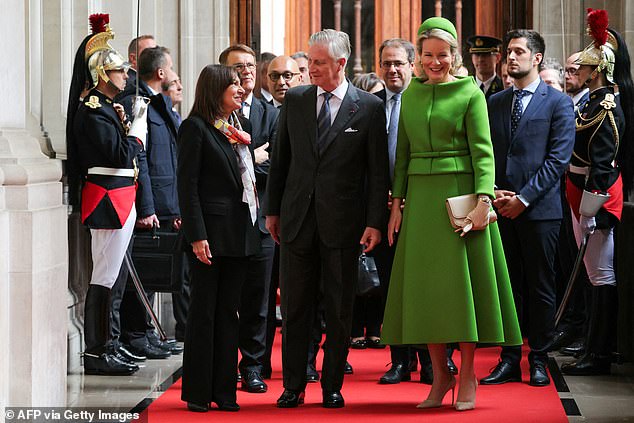 Along with King Philippe, 64, Mathilde, 51, greeted the mayor of Paris, Anne Hidalgo, before entering the town hall where they attended a meeting as part of their state visit to France.