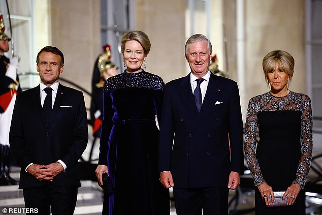 Belgium's King Philippe (centre right) and Queen Mathilde (centre left) posed alongside French President Emmanuel Macron (left) and his wife Brigitte Macron (right) before a state dinner at the Elysee Palace as part of their three-day state visit to France