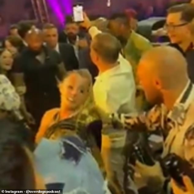 McGregor's fiancée was forced to stop the UFC star from dancing with another woman (left)