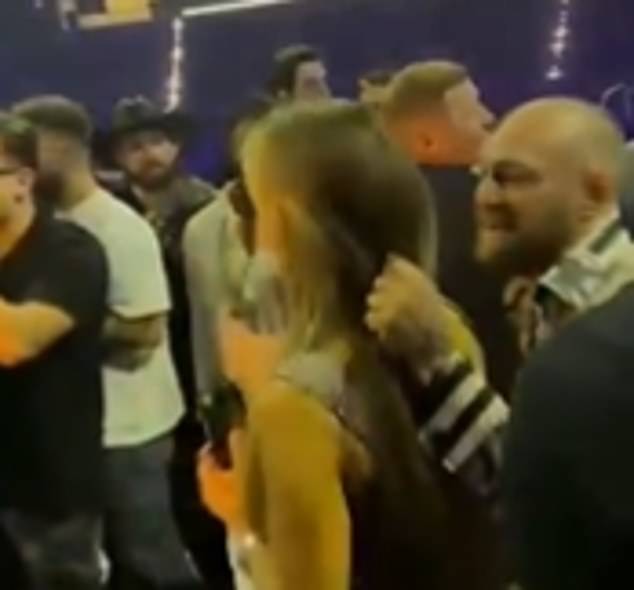 Dee Devlin (left) was seen moving between the pair, and McGregor was then seen taking a step back before pulling her hair too.