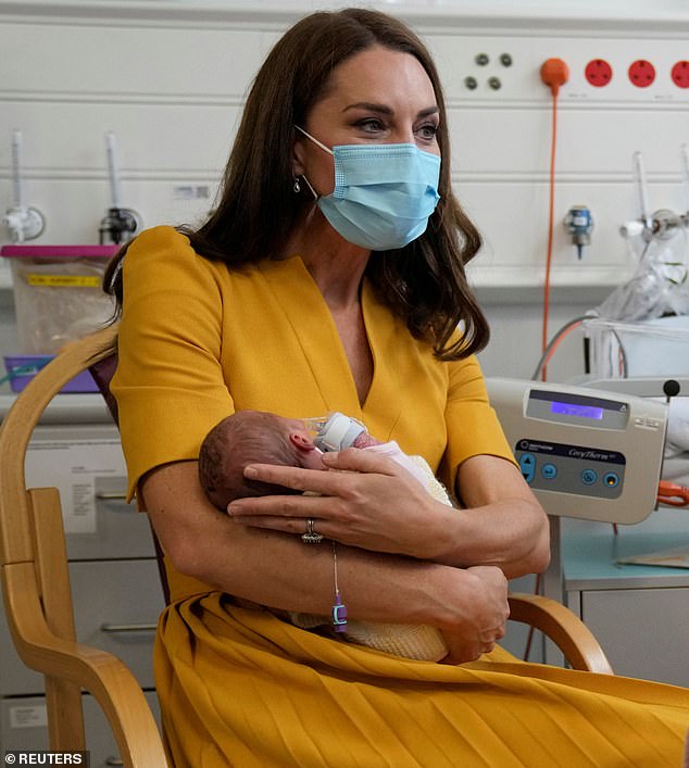 The Princess of Wales looked lovingly at a newborn baby girl, Bianca, in the maternity unit at the Royal Surrey County Hospital in Guildford in 2022.