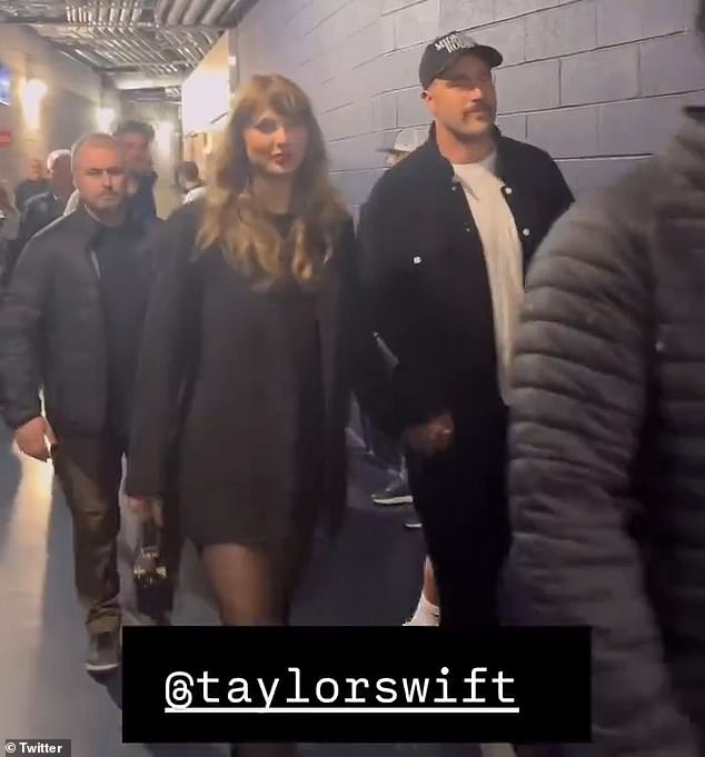 As they left the game, the two held hands while wearing matching black.