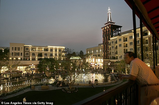 A man looks at what could be said to be the centerpiece of the community: the fountain.