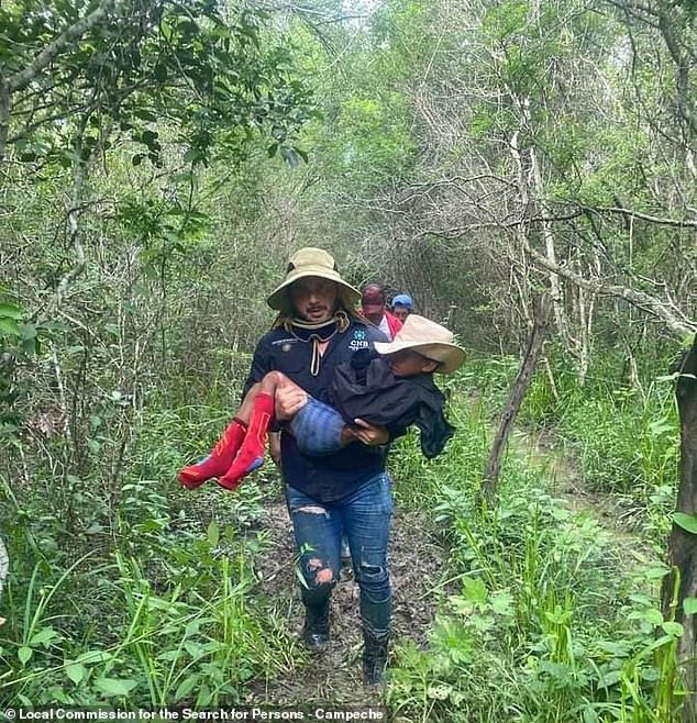 Acosta is taken by one of the workers assigned to the Local Persons Search Commission of the State of Campeche after being found in the jungle