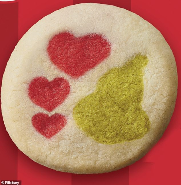 Next to the hearts, there appears to be a green spot stamped on the cookie, and it's leaving fans divided over what it actually should be.