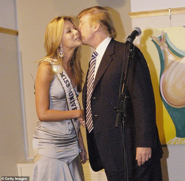 Donald Trump kisses Miss Universe, Jennifer Hawkins, at a cocktail party in New York in 2004