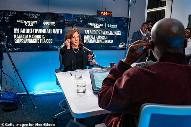 Democratic presidential candidate Vice President Kamala Harris (left) prepares to speak with Charlamagne Tha God