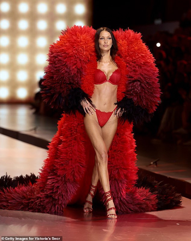 The 28-year-old bombshell showed off her fit figure in a red bra and underwear, topped off with a huge red fur coat.