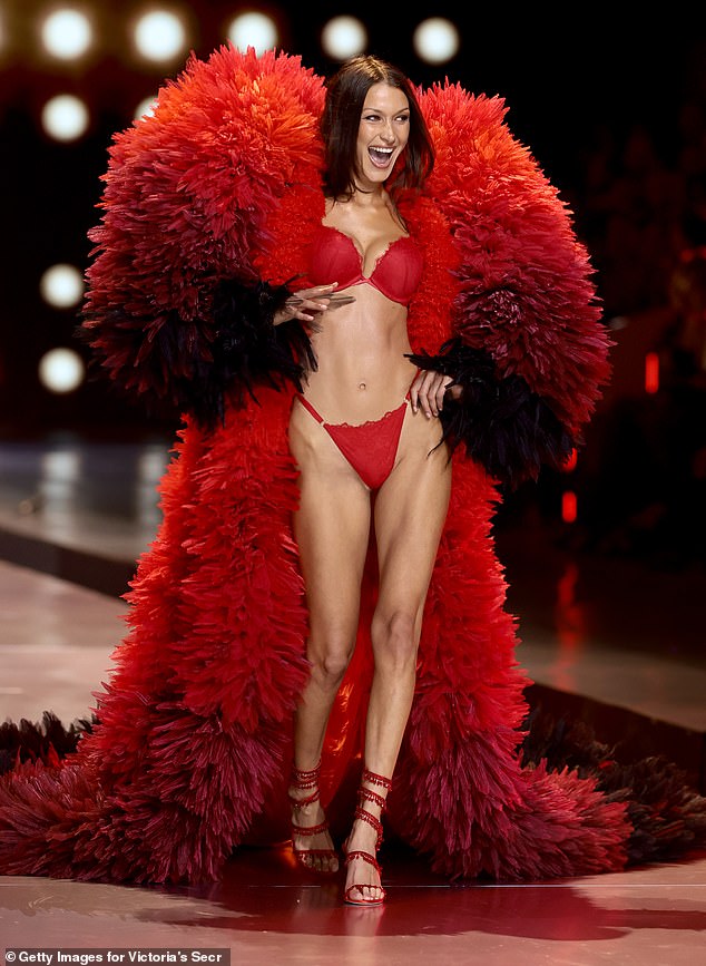 Bella flashed her megawatt smile as she stormed the runway in strappy red heels.