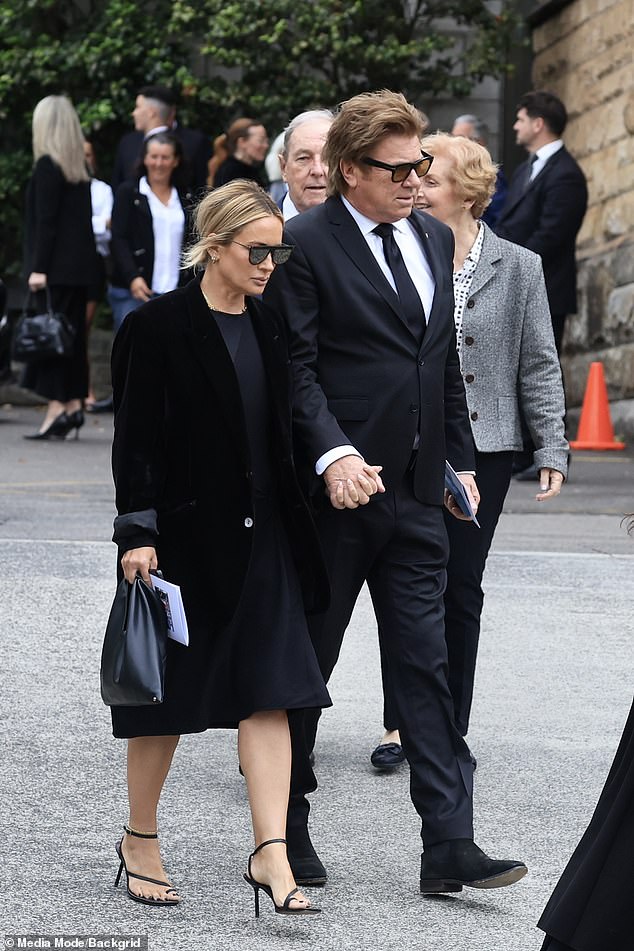 The veteran entertainment reporter held the famous makeup artist's hand as they headed to St. Francis Xavier Church in Lavender Bay to say a final goodbye to Janelle Kidman.