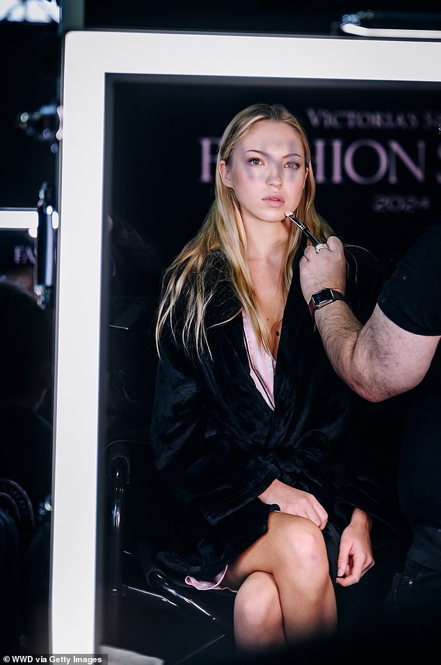 Lila was photographed getting ready backstage in Brooklyn for the Victoria's Secret Fashion Show on Tuesday while surrounded by makeup artists.